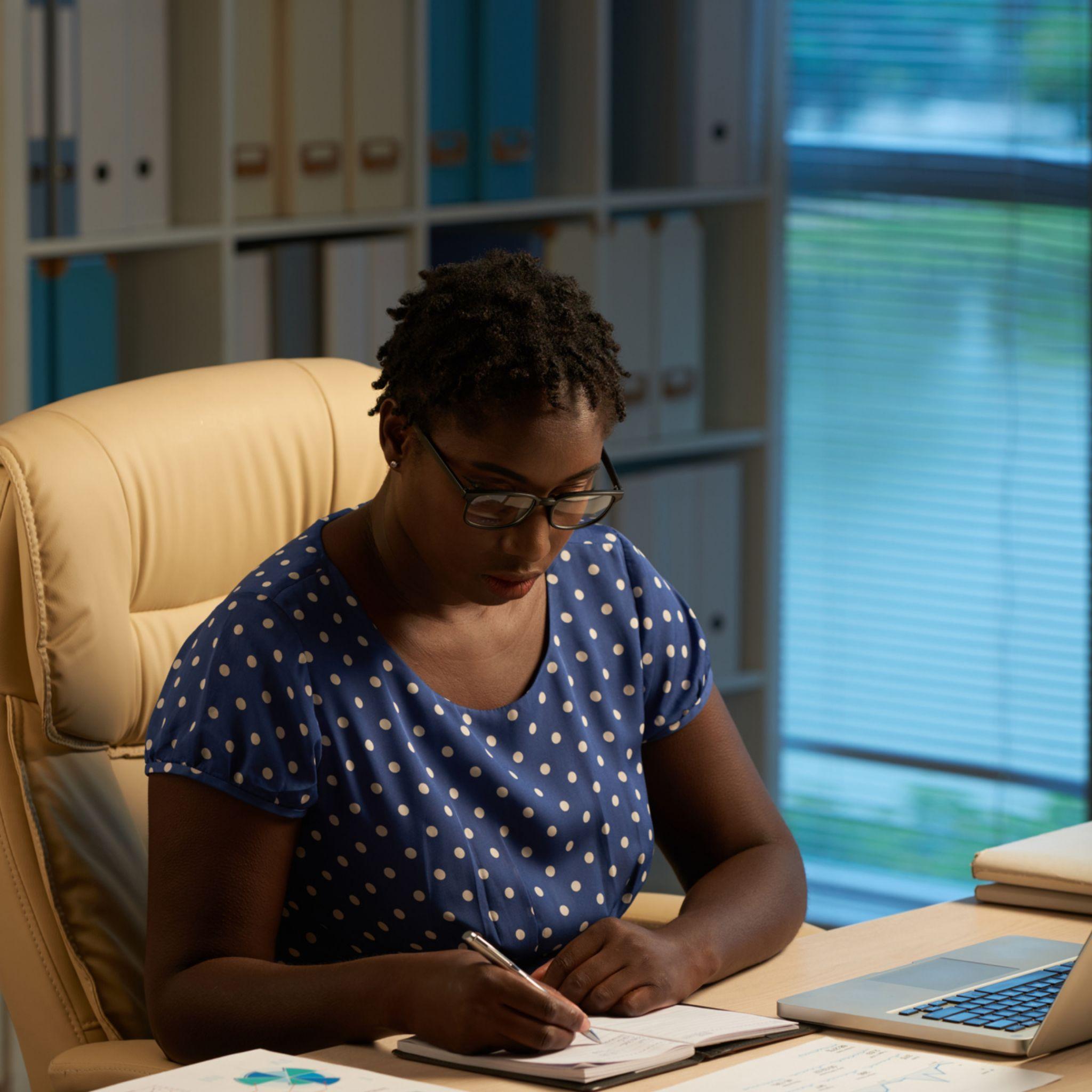 Lady brainstorming a list of business name ideas